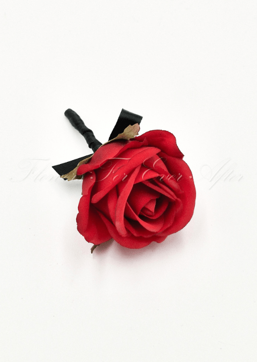 Artificial wedding boutonniere, top view of a red faux rose with a black ribbon bow and wrapped stem. For formals, proms and ball occasions. Made in Melbourne by Flowers For Ever After, shipping Australia and Worldwide.