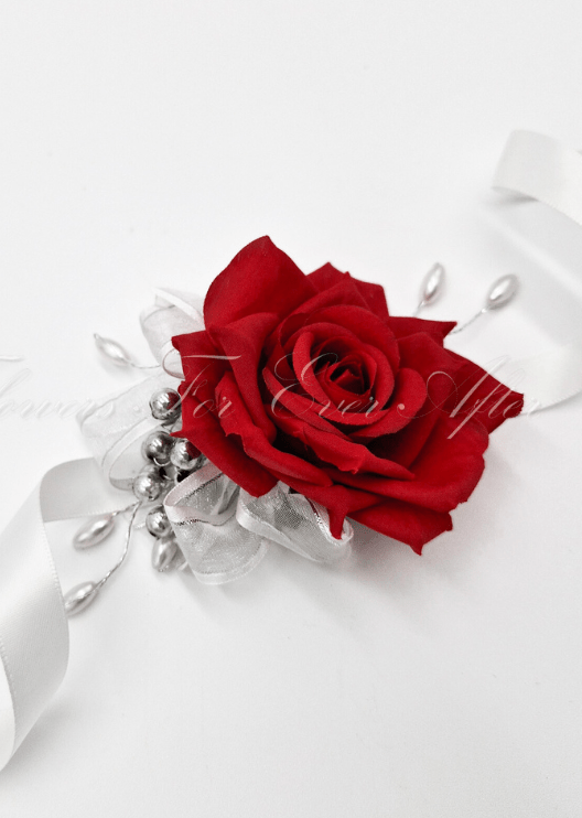 Artificial wedding wrist corsage with a red faux rose, silver bead sprays and trailing white ribbons. For formals, proms and ball occasions. Made in Melbourne by Flowers For Ever After, shipping Australia and Worldwide.