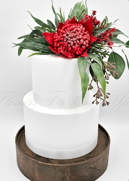 Artificial wedding cake flower set with red faux waratah, yellow wattle and green native-style foliage. For birthday, event and celebration cakes. Made in Melbourne by Flowers For Ever After, shipping Australia and Worldwide.