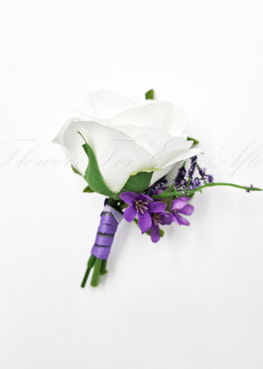 Artificial wedding boutonniere with a white faux rose, purple flowers, lavender sprigs and a purple ribbon-wrapped stem. For formals, proms and ball occasions. Made in Melbourne by Flowers For Ever After, shipping Australia and Worldwide.