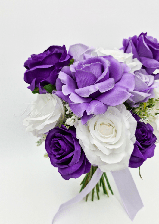 Artificial wedding rose posy, top view of purple, lilac and white faux roses with small white filler flowers. Made in Melbourne by Flowers For Ever After, shipping Australia and Worldwide.