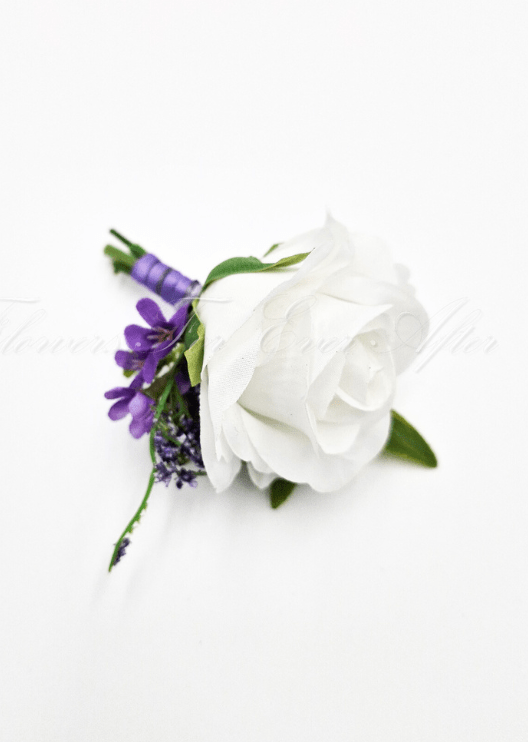 Artificial wedding boutonniere, top view of a white faux rose, small purple flowers and lavender sprigs. For formals, proms and ball occasions. Made in Melbourne by Flowers For Ever After, shipping Australia and Worldwide.