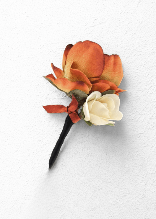 Artificial wedding boutonniere with a rust-orange faux orchid, an ivory rosebud, small rust ribbon bow and black-wrapped stem. For formals, proms and ball occasions. Made in Melbourne by Flowers For Ever After, shipping Australia and Worldwide.