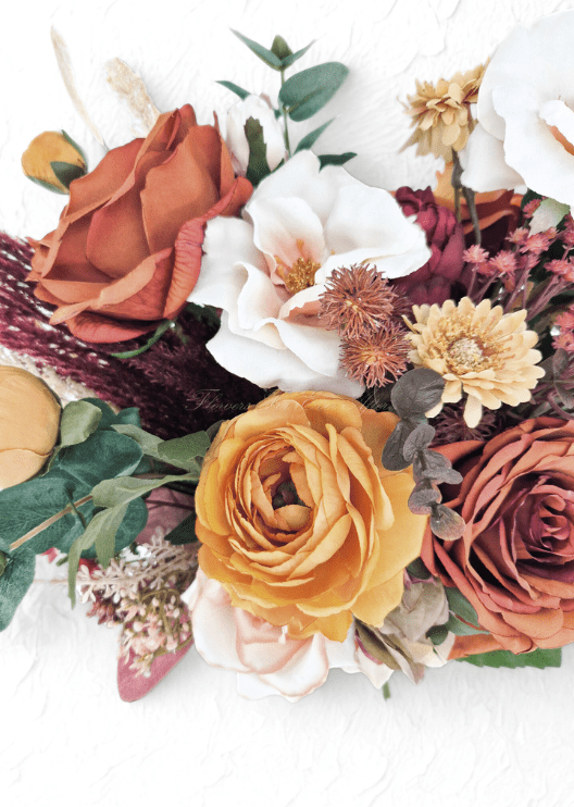 Artificial wedding bouquet close-up with rust and golden yellow faux roses, white open bloom, golden daisy and bronze spiky flower heads. Made in Melbourne by Flowers For Ever After, shipping Australia and Worldwide.