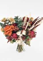 Artificial wedding bouquet, reverse view of rust and burgundy faux roses, cream flowers, bronze spiky heads and eucalyptus. Made in Melbourne by Flowers For Ever After, shipping Australia and Worldwide.