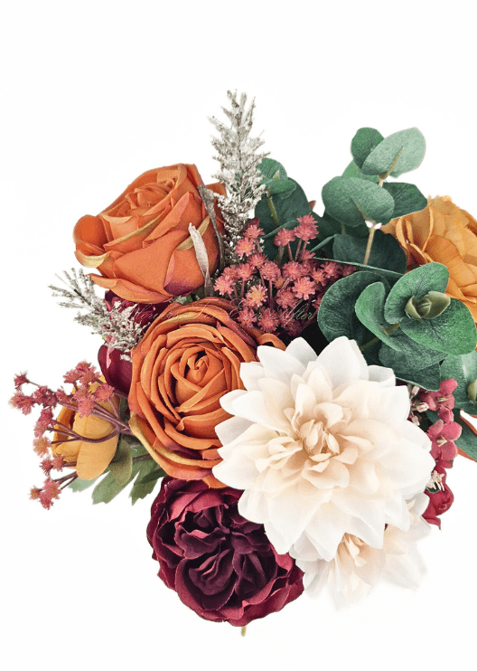 Artificial wedding bouquet close-up with rust and burgundy faux roses, cream dahlia, tiny reddish flowers and eucalyptus. Made in Melbourne by Flowers For Ever After, shipping Australia and Worldwide.