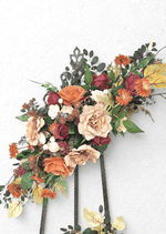 Artificial wedding large arbor spray with rust, burgundy and beige faux roses, orange daisies, white ranunculus and yellow leaves. Made in Melbourne by Flowers For Ever After, shipping Australia and Worldwide.