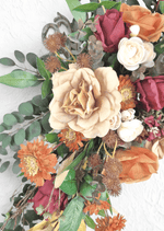 Artificial wedding arbor flower close-up with a beige faux rose, rust roses, white ranunculus, orange daisies and bronze spiky heads. Made in Melbourne by Flowers For Ever After, shipping Australia and Worldwide.