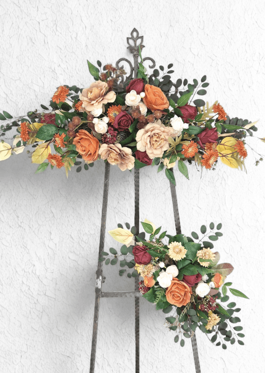 Artificial wedding arbor floral set with rust, burgundy and beige faux roses, orange daisies, white ranunculus and green and yellow foliage. Made in Melbourne by Flowers For Ever After, shipping Australia and Worldwide.