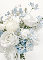 Artificial wedding bouquet close-up with white faux roses, pale blue flowers, blue hydrangea and dangling pearl strands. Made in Melbourne by Flowers For Ever After, shipping Australia and Worldwide.