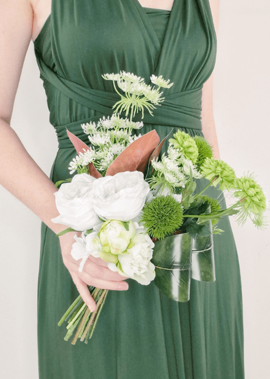 Artificial wedding bouquet, handheld angled view of white faux roses, green pompom flowers, white sprigs and brown leaves. Made in Melbourne by Flowers For Ever After, shipping Australia and Worldwide.