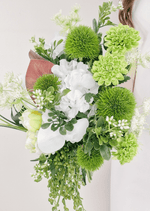 Artificial wedding bouquet detail showing green faux pompom flowers, lime green blooms, fine white sprigs and trailing green buds. Made in Melbourne by Flowers For Ever After, shipping Australia and Worldwide.