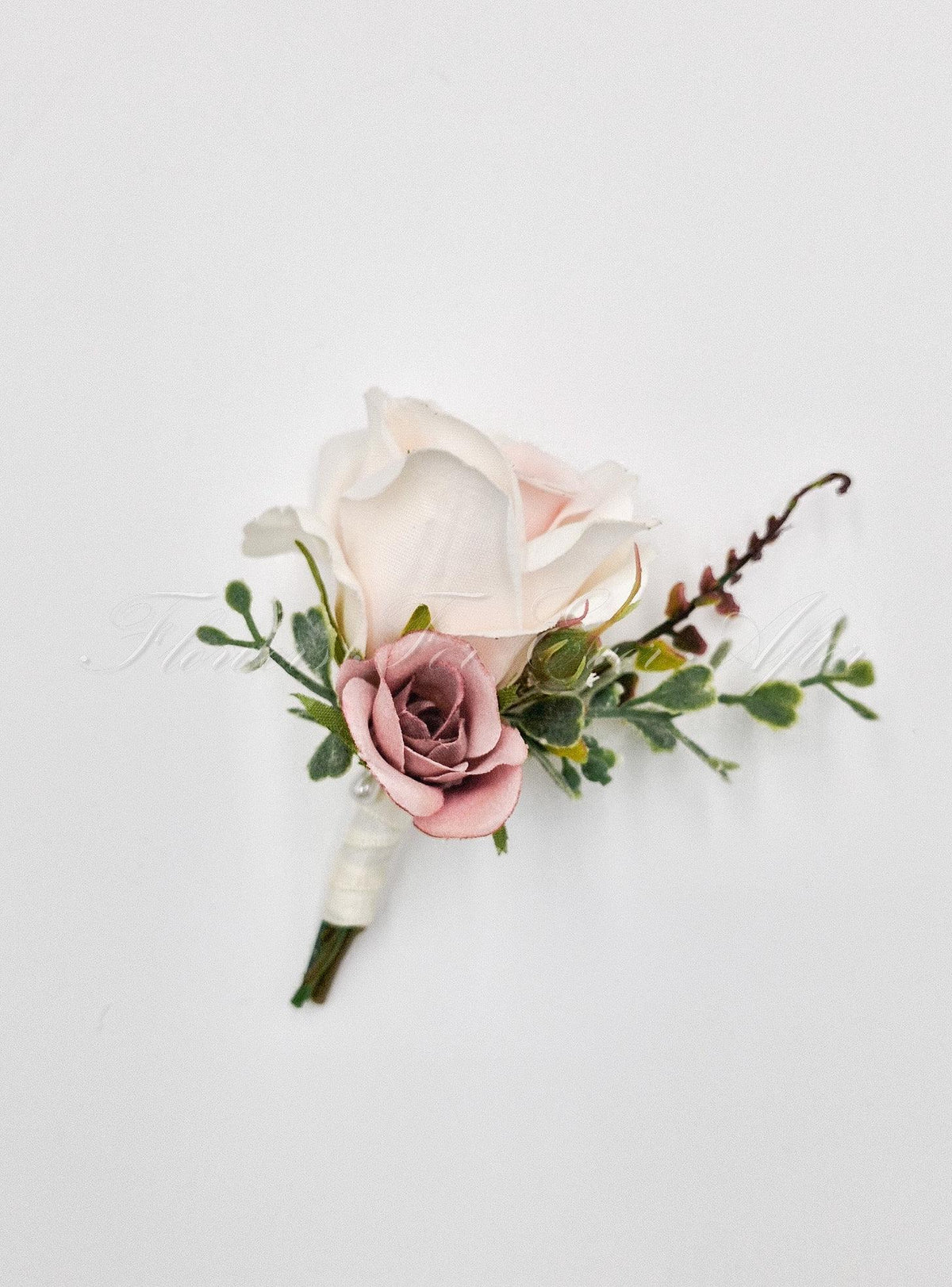 Artificial wedding groom boutonniere with a pale blush faux rose, smaller dusty pink rose, greenery and ivory-wrapped stems. For formals, proms and ball occasions. Made in Melbourne by Flowers For Ever After, shipping Australia and Worldwide.