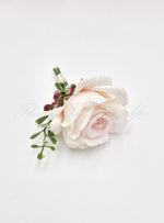 Artificial wedding groomsman boutonniere, front view of a pale blush faux rose with greenery and burgundy accents. For formals, proms and ball occasions. Made in Melbourne by Flowers For Ever After, shipping Australia and Worldwide.
