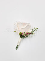 Artificial wedding groomsman boutonniere, side view of a pale blush faux rose, greenery and ivory-wrapped stems. For formals, proms and ball occasions. Made in Melbourne by Flowers For Ever After, shipping Australia and Worldwide.