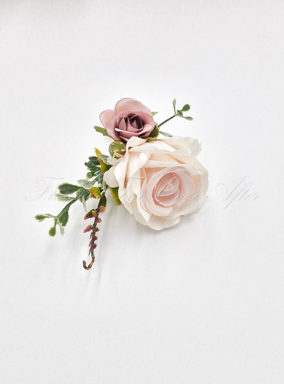 Artificial wedding groom boutonniere close-up with pale blush and dusty pink faux roses and green foliage. For formals, proms and ball occasions. Made in Melbourne by Flowers For Ever After, shipping Australia and Worldwide.