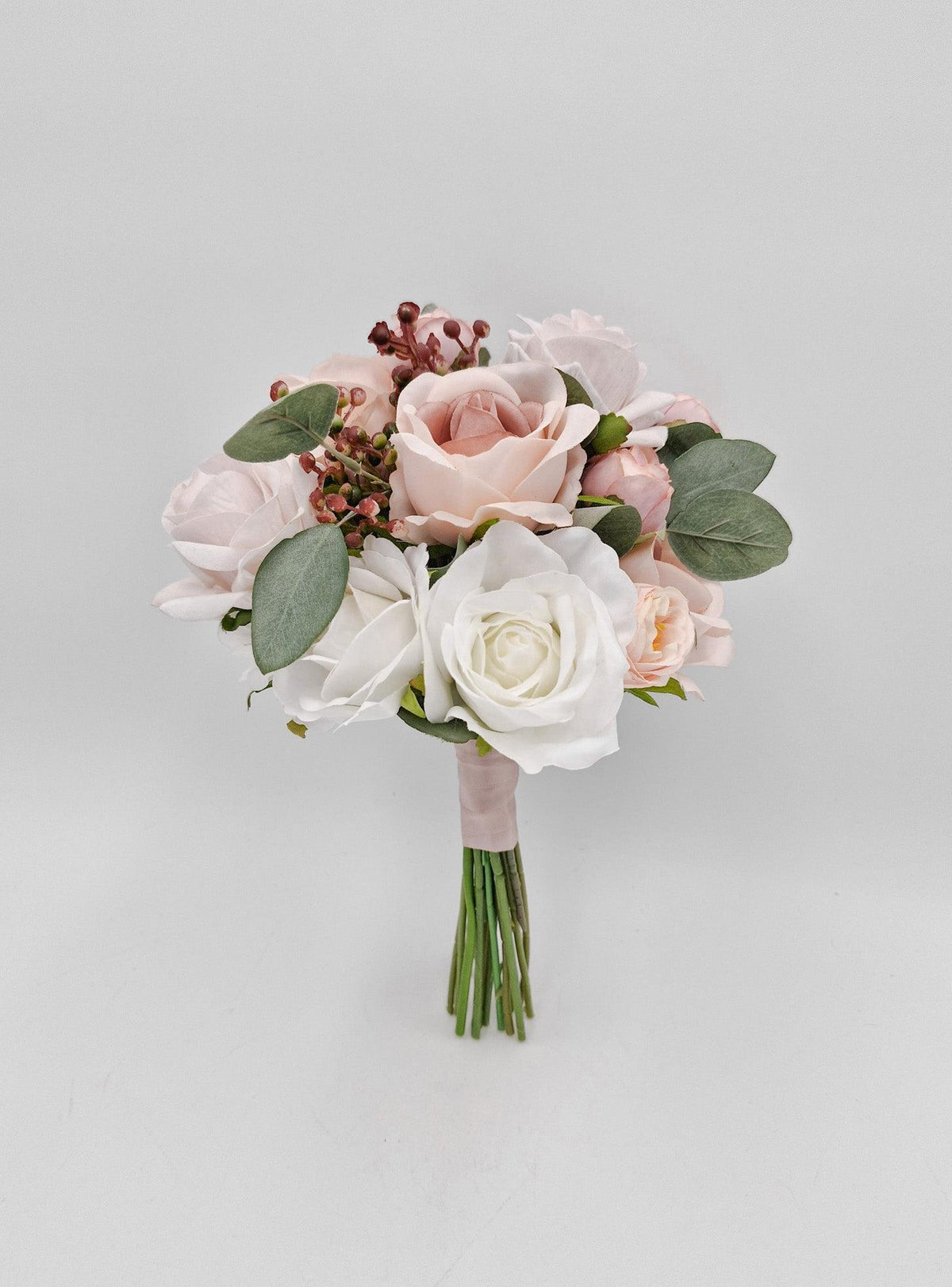 Artificial wedding flower girl posy, front view of blush and white faux roses with eucalyptus and green stems. Made in Melbourne by Flowers For Ever After, shipping Australia and Worldwide.