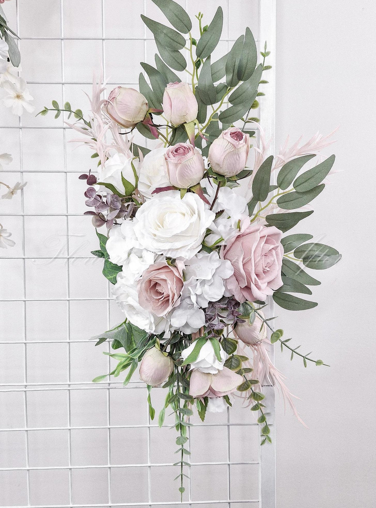 Artificial wedding ceremony arrangement close-up with blush and white faux roses, eucalyptus and trailing greenery. Made in Melbourne by Flowers For Ever After, shipping Australia and Worldwide.