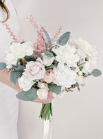 Artificial wedding bridal bouquet, side view of blush faux roses, white blooms, eucalyptus and pink sprigs with exposed green stems. Made in Melbourne by Flowers For Ever After, shipping Australia and Worldwide.