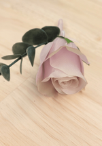 Artificial wedding boutonniere close-up showing pale lavender faux rosebud petals and grey-green foliage. For formals, proms and ball occasions. Made in Melbourne by Flowers For Ever After, shipping Australia and Worldwide.