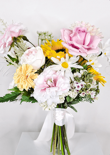 Artificial wedding bridesmaid bouquet, overhead view of mixed faux blooms and green leaves. Made in Melbourne by Flowers For Ever After, shipping Australia and Worldwide.