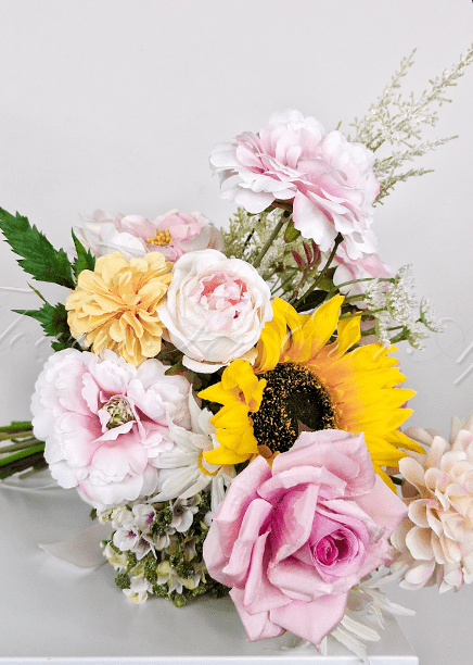 Artificial wedding bridesmaid bouquet, front view of mixed faux flowers and green leaves. Made in Melbourne by Flowers For Ever After, shipping Australia and Worldwide.