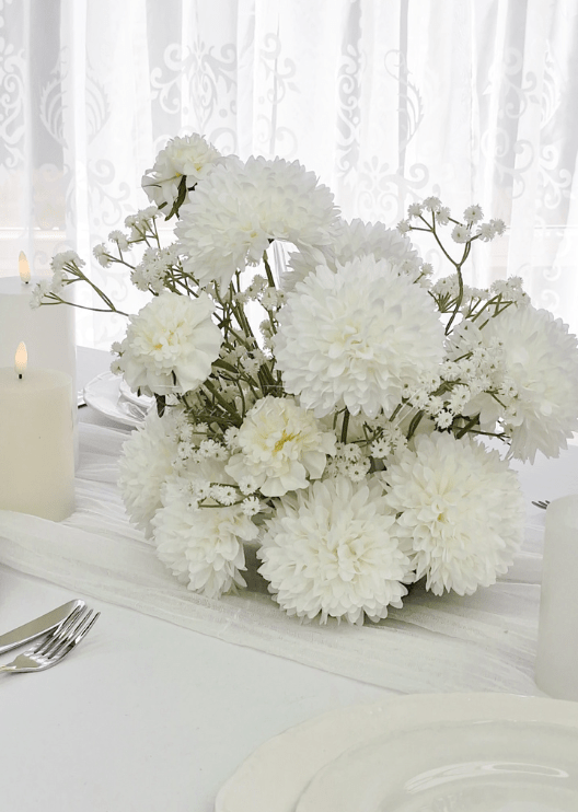 Artificial wedding low table centrepiece with clustered white faux flowers and green foliage. Made in Melbourne by Flowers For Ever After, shipping Australia and Worldwide.