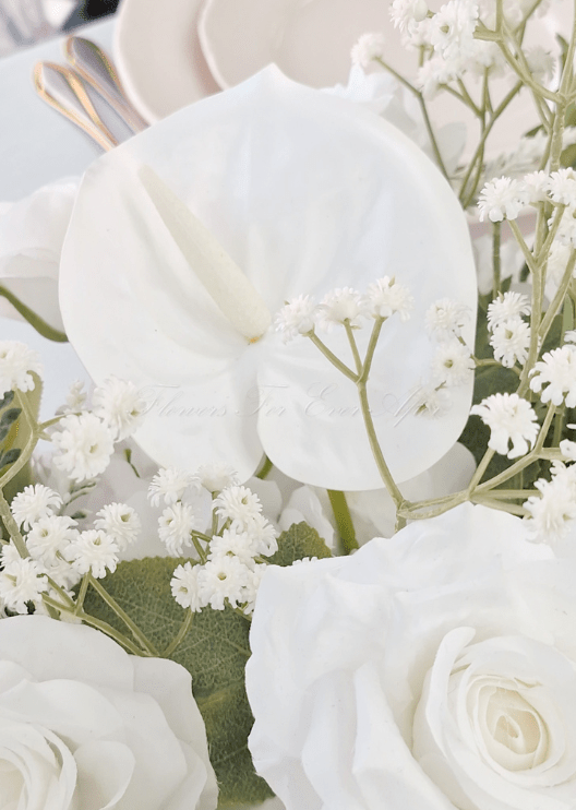 Artificial wedding table arrangement, reverse view of white faux roses, white orchids, hydrangea and green foliage. Made in Melbourne by Flowers For Ever After, shipping Australia and Worldwide.