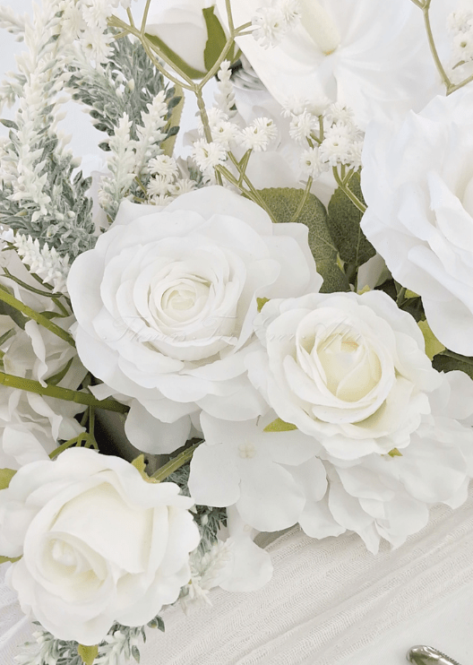 Artificial wedding low floral centrepiece with white faux roses, orchids, hydrangea and fine white sprigs. Made in Melbourne by Flowers For Ever After, shipping Australia and Worldwide.