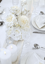 Artificial wedding table centrepiece, overhead view of cream and white faux blooms with roses and delicate baby's breath. Made in Melbourne by Flowers For Ever After, shipping Australia and Worldwide.