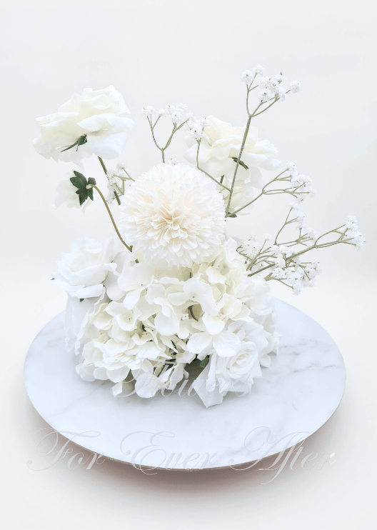 Artificial wedding floral centrepiece with white faux hydrangea, a large cream bloom and tall branching baby's breath. Made in Melbourne by Flowers For Ever After, shipping Australia and Worldwide.