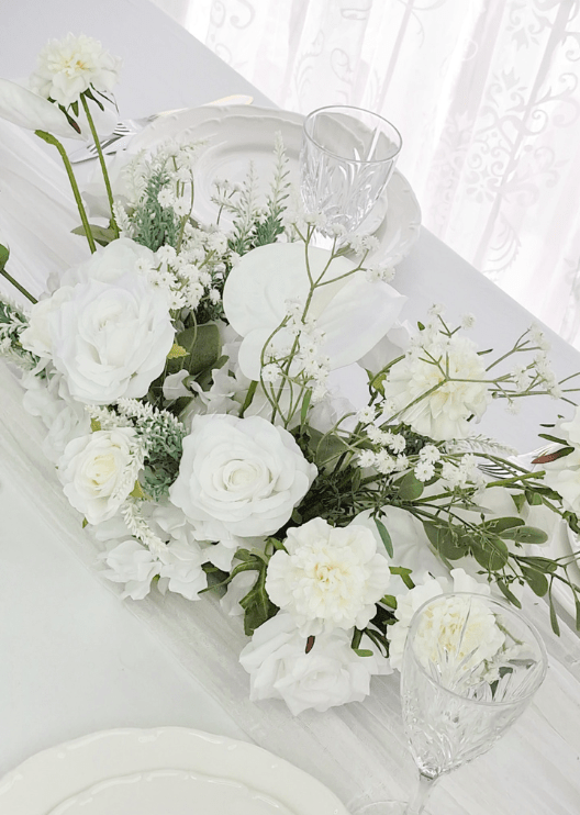 Artificial wedding low table arrangement with white faux roses, orchids, hydrangea, fine white flowers and green foliage. Made in Melbourne by Flowers For Ever After, shipping Australia and Worldwide.