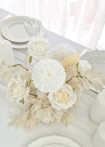 Artificial wedding table centrepiece, angled view of white faux blooms and green leaves. Made in Melbourne by Flowers For Ever After, shipping Australia and Worldwide.