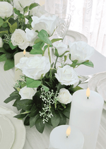 Artificial wedding table arrangement close-up showing layered white faux flower petals and green foliage. Made in Melbourne by Flowers For Ever After, shipping Australia and Worldwide.