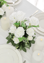 Artificial wedding table arrangement, front view of white faux blooms and green leaves. Made in Melbourne by Flowers For Ever After, shipping Australia and Worldwide.