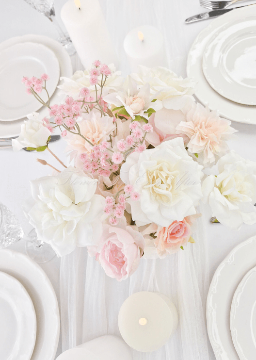 Artificial wedding table centrepiece, angled view of mixed faux flowers and green leaves. Made in Melbourne by Flowers For Ever After, shipping Australia and Worldwide.