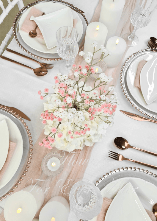Artificial wedding table centrepiece, overhead view of white faux hydrangea and delicate pink and white baby's breath. Made in Melbourne by Flowers For Ever After, shipping Australia and Worldwide.
