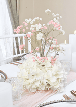 Artificial wedding table centrepiece with a rounded white faux hydrangea base and tall pink and white baby's breath sprigs. Made in Melbourne by Flowers For Ever After, shipping Australia and Worldwide.