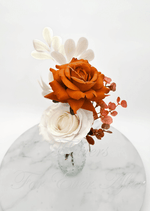 Artificial wedding bud-vase arrangement, overhead view of rust-orange and white faux roses and copper-coloured eucalyptus. Made in Melbourne by Flowers For Ever After, shipping Australia and Worldwide.