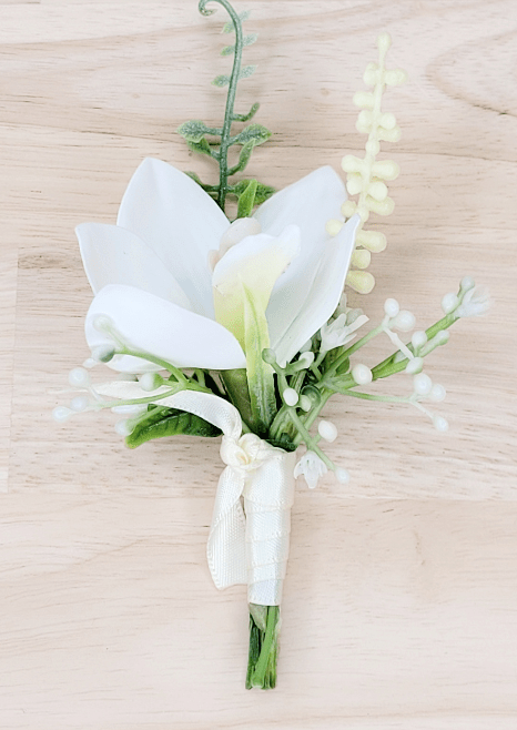 Artificial wedding boutonniere with white faux orchid, pale berry sprigs, curling green stem and white ribbon wrapping. For formals, proms and ball occasions. Made in Melbourne by Flowers For Ever After, shipping Australia and Worldwide.