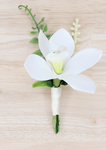 Artificial wedding boutonniere with white faux orchid, pale berries, curled green sprig and white-wrapped stem. For formals, proms and ball occasions. Made in Melbourne by Flowers For Ever After, shipping Australia and Worldwide.