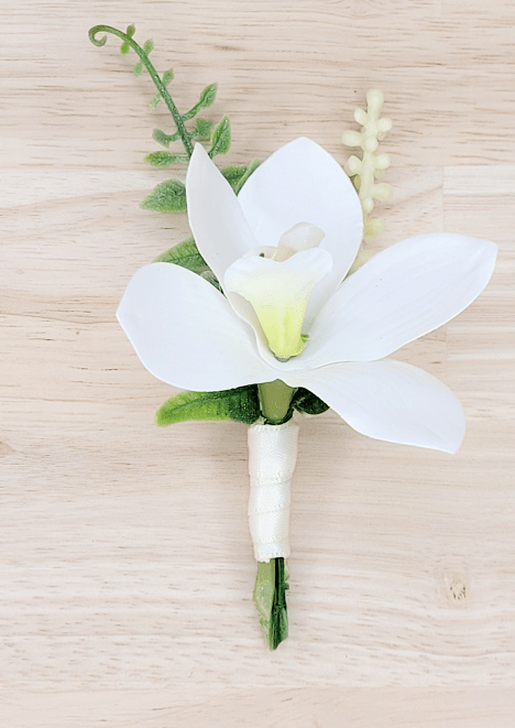 Artificial wedding boutonniere with white faux orchid, pale berries, curled green sprig and white-wrapped stem. For formals, proms and ball occasions. Made in Melbourne by Flowers For Ever After, shipping Australia and Worldwide.