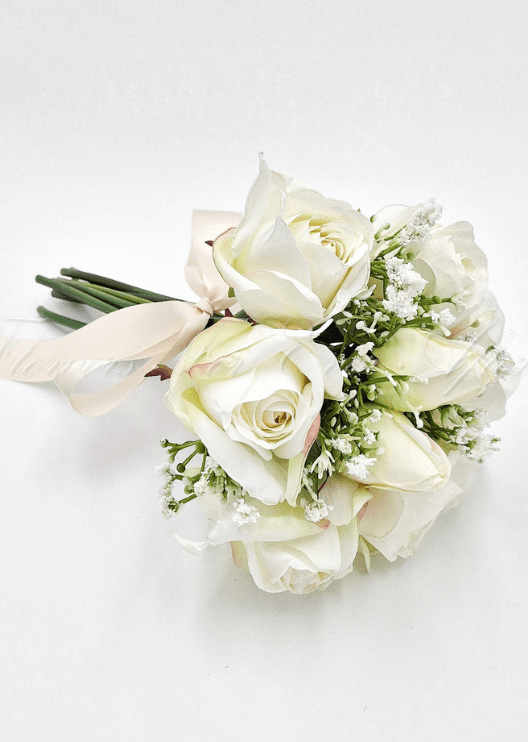 Artificial wedding toss posy with small white faux flowers, green foliage and ribbon-wrapped stems. Made in Melbourne by Flowers For Ever After, shipping Australia and Worldwide.