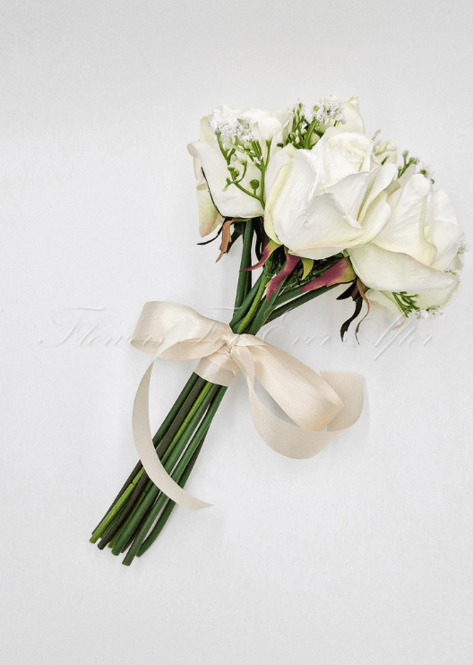Artificial wedding toss posy, top view of small white faux blooms and green foliage. Made in Melbourne by Flowers For Ever After, shipping Australia and Worldwide.