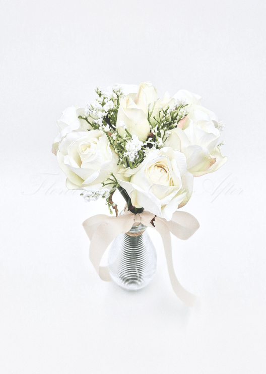 Artificial wedding toss posy with white faux blooms, green leaves and a ribbon-wrapped handle. Made in Melbourne by Flowers For Ever After, shipping Australia and Worldwide.
