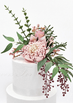 Artificial wedding cake decoration, angled view of pink faux waratah and green foliage. For birthday, event and celebration cakes. Made in Melbourne by Flowers For Ever After, shipping Australia and Worldwide.