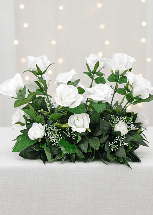Artificial wedding long garden-style arrangement with white faux flowers and green foliage. Made in Melbourne by Flowers For Ever After, shipping Australia and Worldwide.