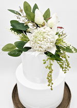 Artificial wedding cake flower set with white faux waratah and green native-style foliage. For birthday, event and celebration cakes. Made in Melbourne by Flowers For Ever After, shipping Australia and Worldwide.
