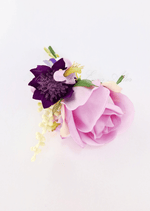 Artificial wedding boutonniere, top view of a pink faux rose, purple flowers and a pale flower spike. For formals, proms and ball occasions. Made in Melbourne by Flowers For Ever After, shipping Australia and Worldwide.