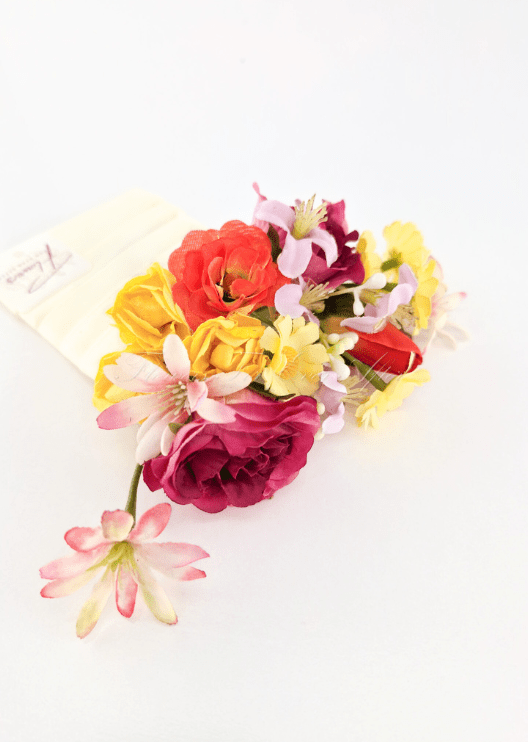 Artificial wedding pocket corsage, overhead view of yellow, orange and magenta faux roses with pink blossoms and yellow daisies. For formals, proms and ball occasions. Made in Melbourne by Flowers For Ever After, shipping Australia and Worldwide.